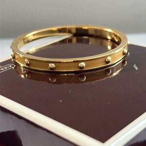 Pre owned Coach yellow and gold-tone 14 dot bracelet
